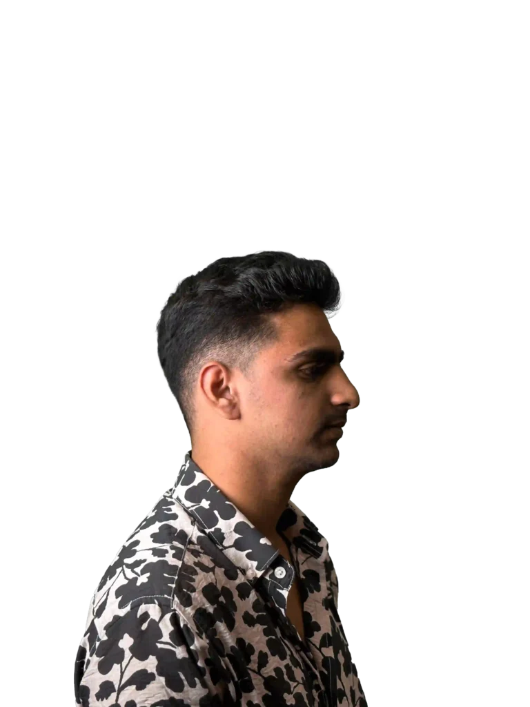Digital Marketing expert in dubai in a black and white floral shirt, standing sideways